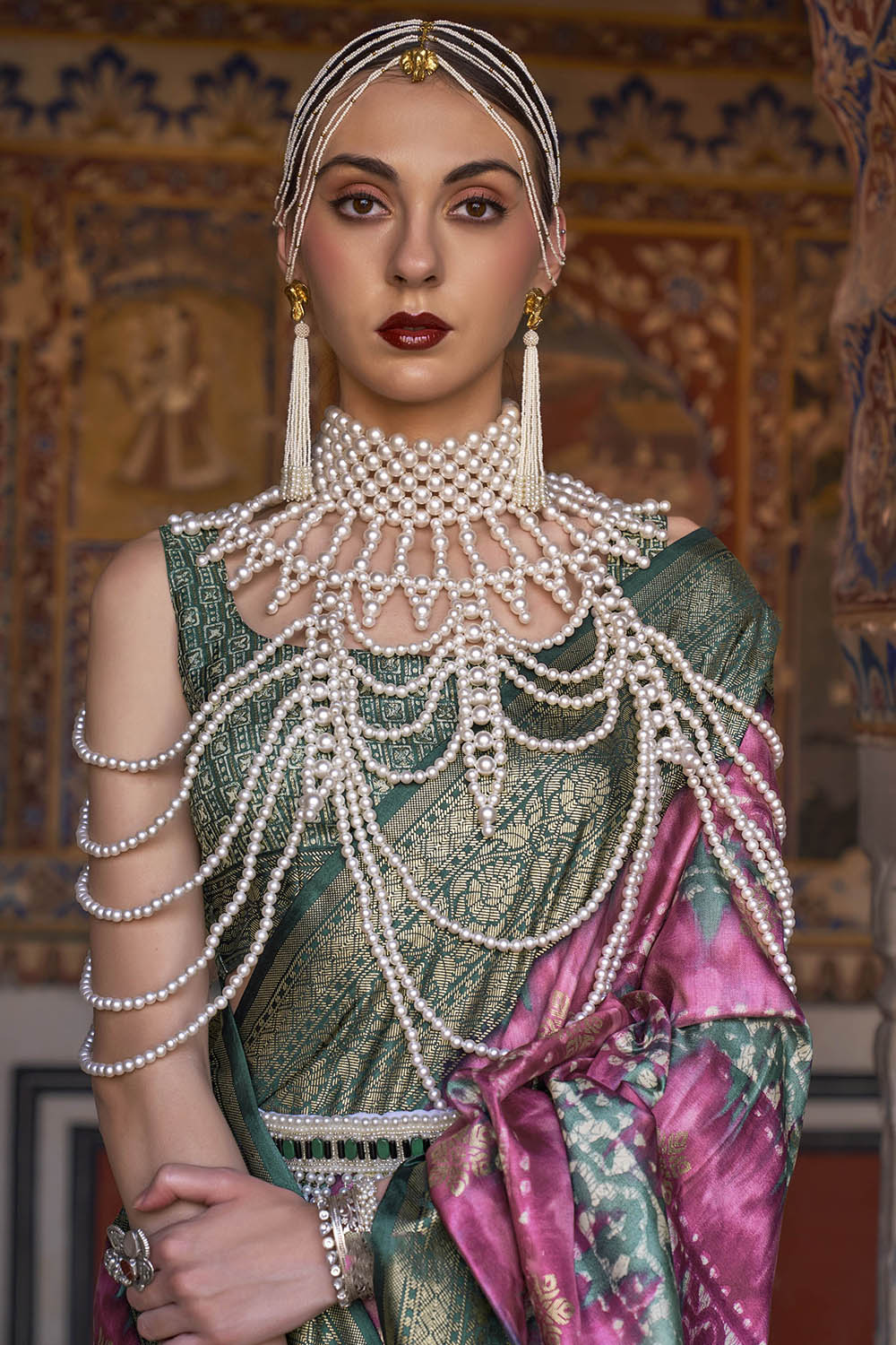 Bubble Gum Pink & Jungle Green Border Patola Saree with Fancy Sleeve Less Blouse