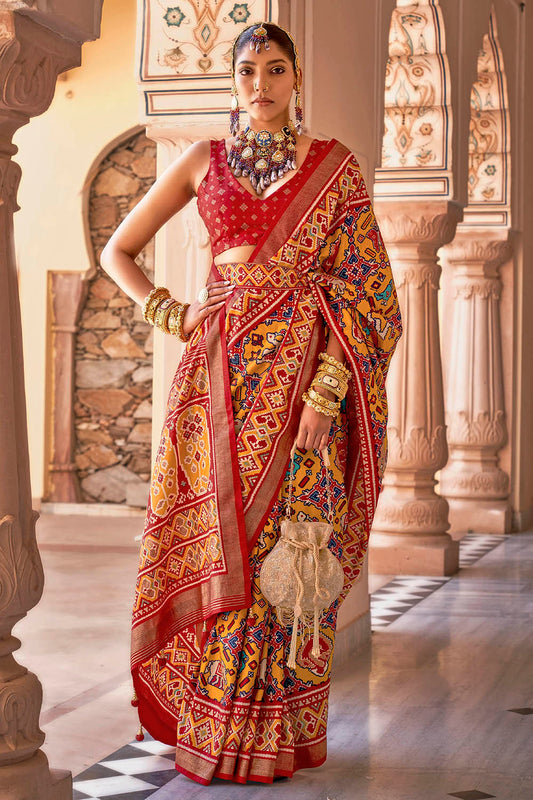 Amber Yellow & Red Border Floral Patola Saree with Red Fancy Sleeve Less Blouse
